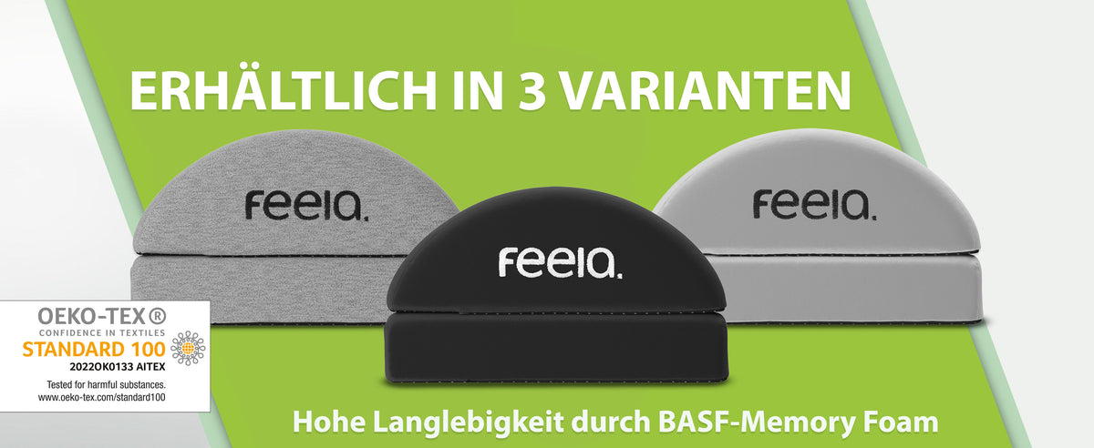 Marketing-Abbildung zeigt drei Varianten der ergonomischen Fußstütze "feelia" nebeneinander aufgereiht. Von links nach rechts: in Dunkelgrau mit weißem Logo, in Schwarz mit weißem Logo und in Silbergrau mit schwarzem Logo. Jede Fußstütze hat eine gewölbte Oberfläche und ist mit dem OEKO-TEX® Standard 100 Logo gekennzeichnet, welches versichert, dass die Materialien auf Schadstoffe geprüft wurden. Ein Text fügt hinzu, dass die Fußstützen eine hohe Langlebigkeit durch BASF-Memory-Schaum bieten.