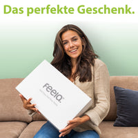 Zufriedene Kundin mit feela. orthopädischem Sitzkissen im Homeoffice
